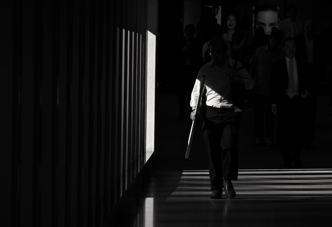Fashion runway show with models walking under stage lights