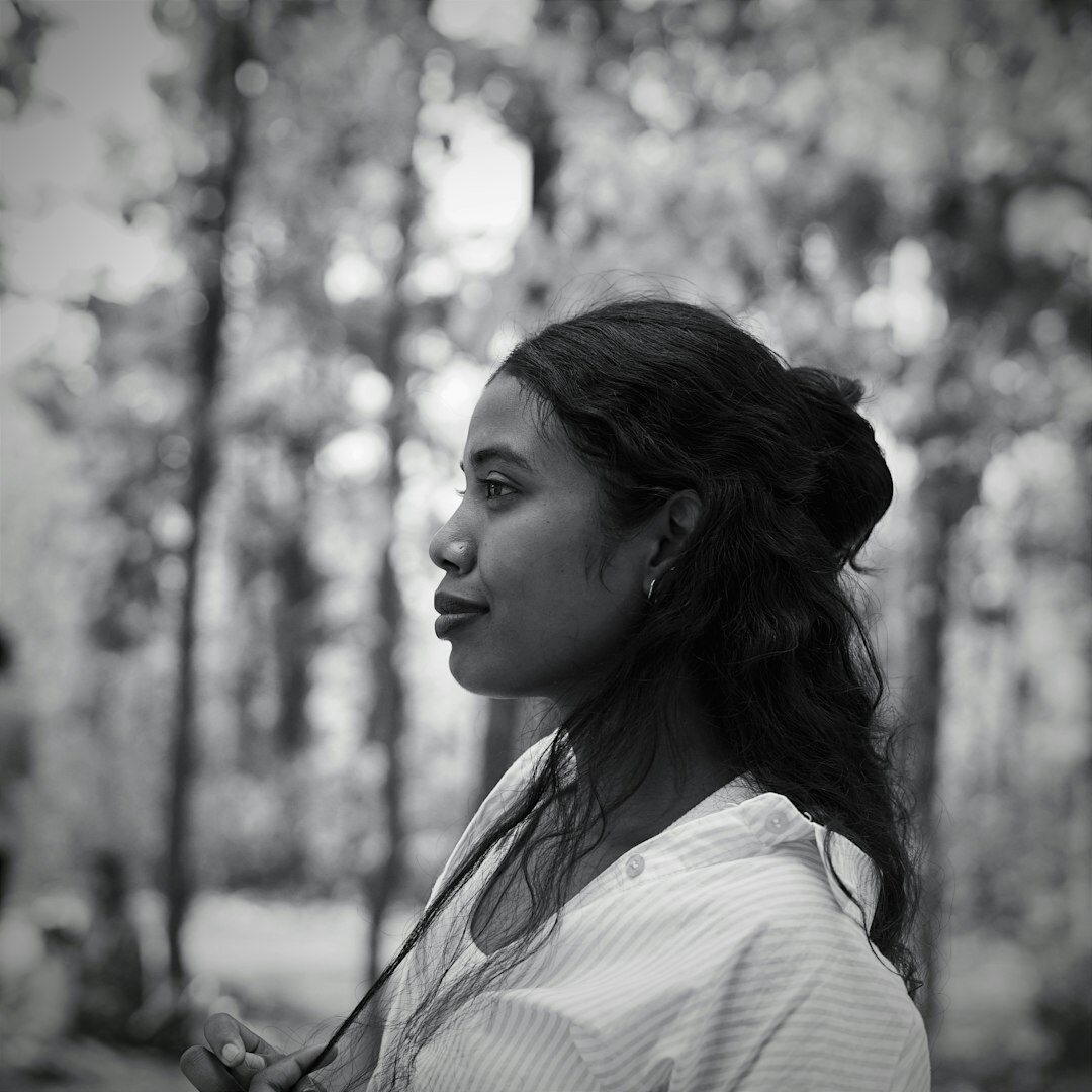 Thoughtful woman editor portrait in soft natural light